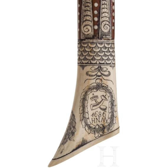 A Saxon miner's axe, dated 1686