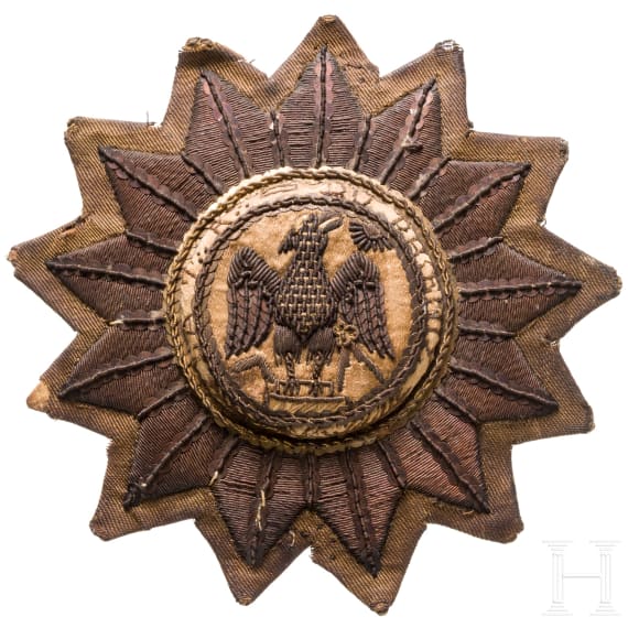 An embroidered fabric star with phoenix, 19th/20th century