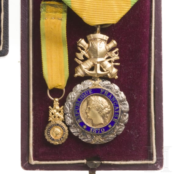 A cased French and Baden medal