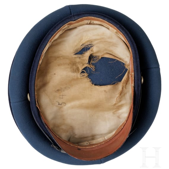 A peaked cap for officers (probably a military doctor) and an epaulette for a first lieutenant, World War I