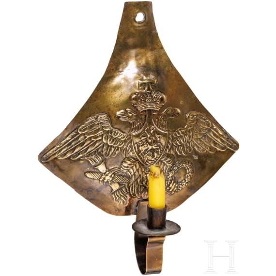 A Russian wall candleholder made from the forehead plate of a cuirassier helmet, circa 1830