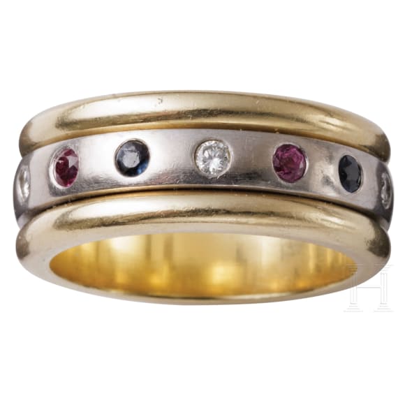 A 14ct white gold band ring set with diamonds, rubies and sapphires