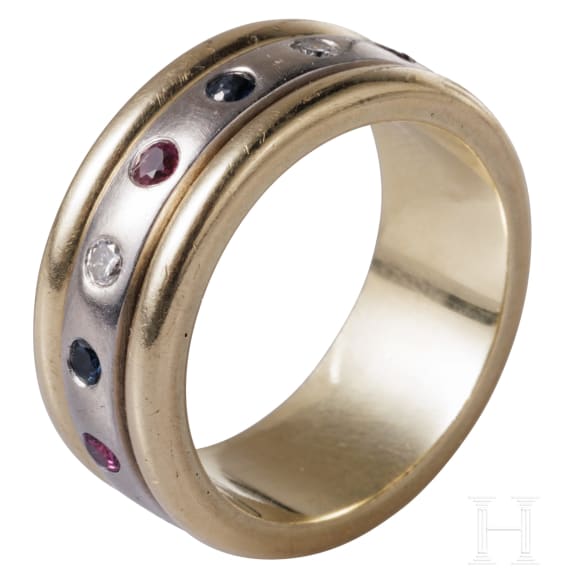 A 14ct white gold band ring set with diamonds, rubies and sapphires