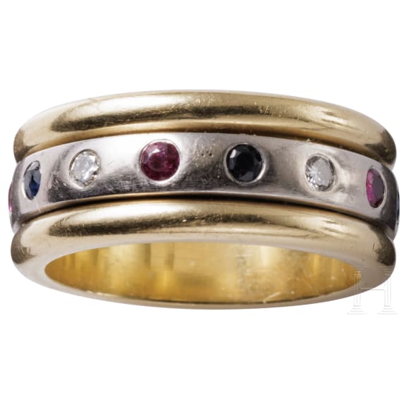 A 14ct white gold band ring set with diamonds, rubies and sapphires