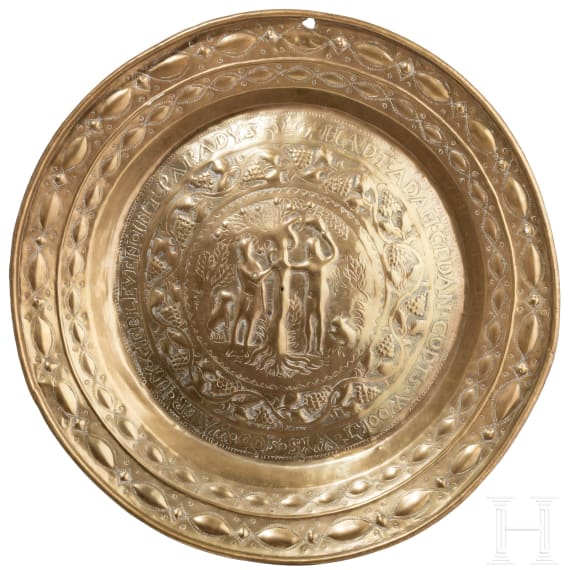 A North German or Dutch brass alms dish with Adam and Eve, 2nd half of the 18th century