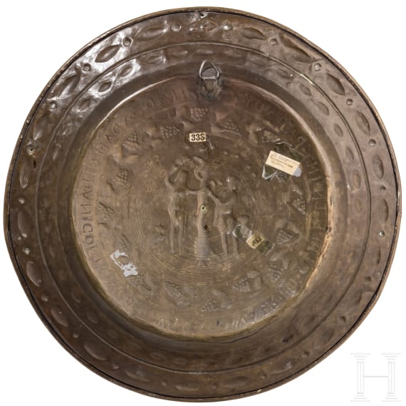 A North German or Dutch brass alms dish with Adam and Eve, 2nd half of the 18th century