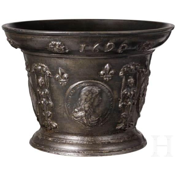 A distinguished, large French apothecary mortar with portrait of Louis XIV, dated 1692