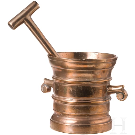 A German brass mortar with volute handles, 17th century
