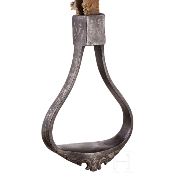 An Indopersian saddle with silver damascened stirrups, 19th century