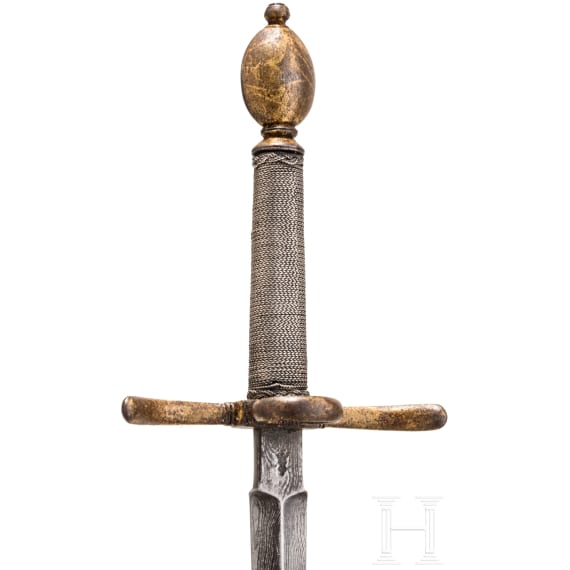 A small gilt German left-hand-dagger, circa 1600