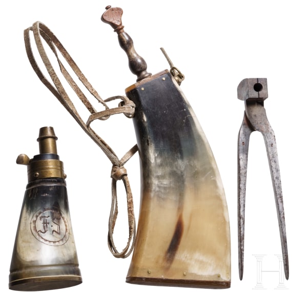 Two German powder flasks and a bullet mould, 19th century
