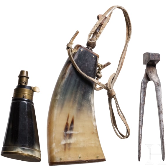 Two German powder flasks and a bullet mould, 19th century
