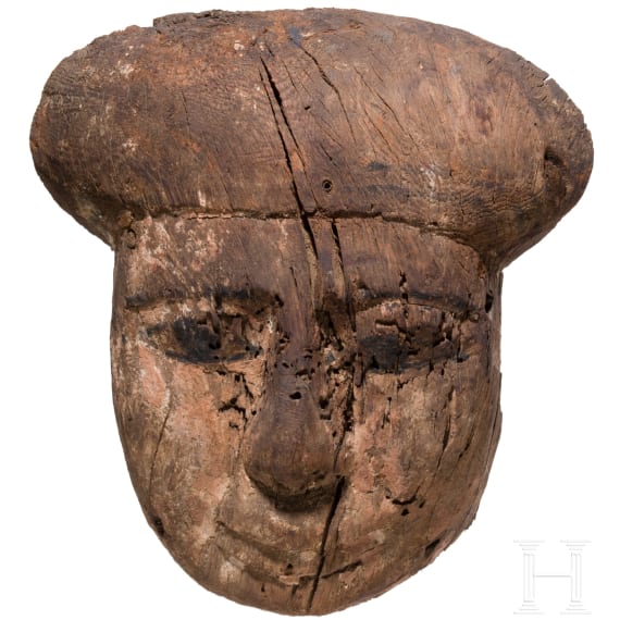 A wooden mummy mask with traces of paint, Late Period, mid-3rd of the 1st millennium B.C.