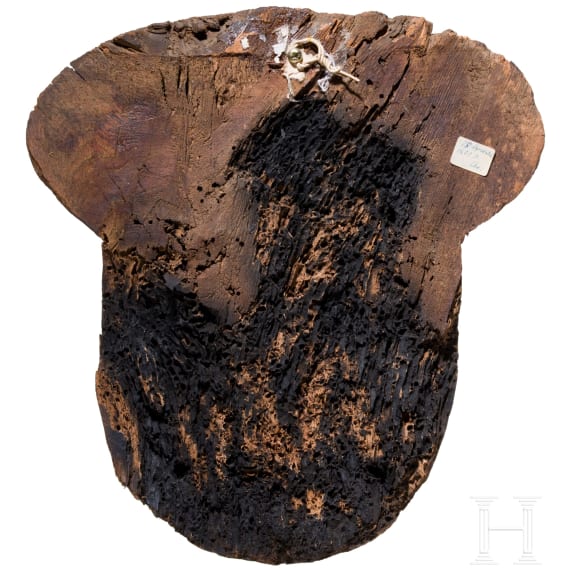 A wooden mummy mask with traces of paint, Late Period, mid-3rd of the 1st millennium B.C.