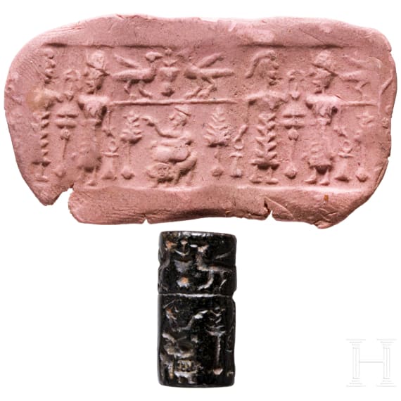 Ancient Babylonian cylinder seal made of brown jasper depicting a cult scene, approx. 1900&ndash;1700 B.C.