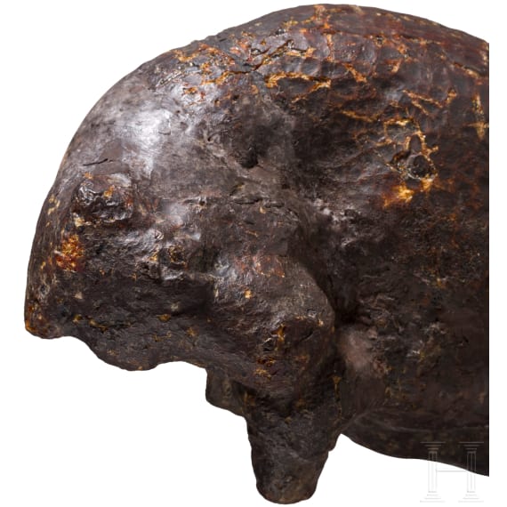 An amber figure of a lying bull, Greek, 4th century B.C.