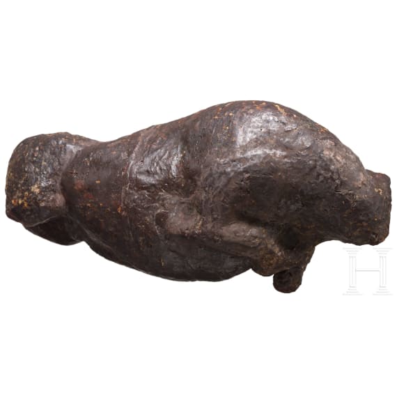 An amber figure of a lying bull, Greek, 4th century B.C.