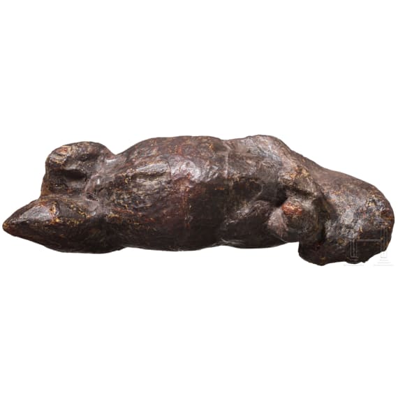 An amber figure of a lying bull, Greek, 4th century B.C.