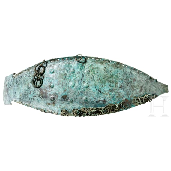 An early Etruscan belt fitting with clasp hook, mid-8th century B.C.