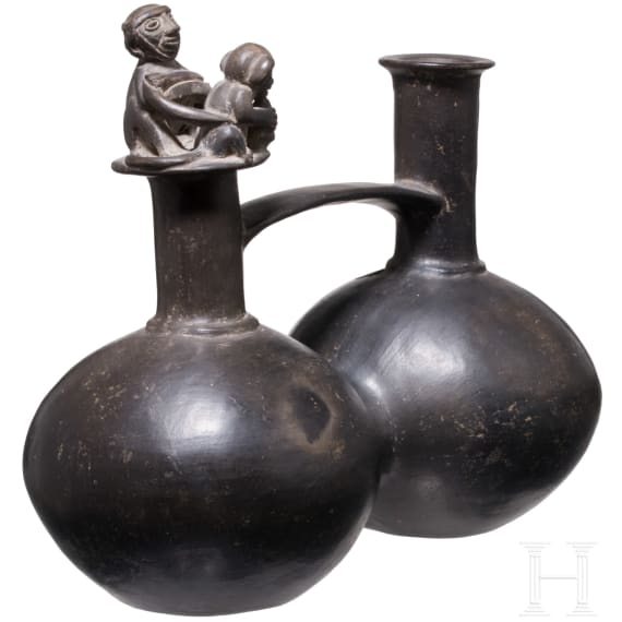 A Peruvian painted clay double-vessel, Chimu culture, probably 11th - 15th century