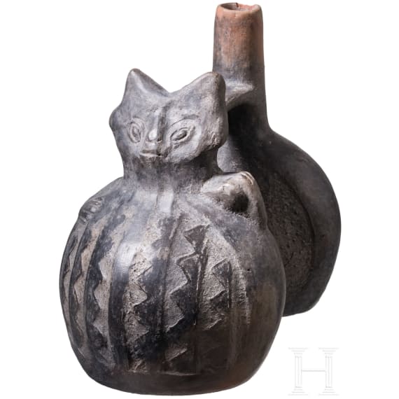 A Peruvian figural clay double-vessel, probably Chimu culture, 11th - 15th century