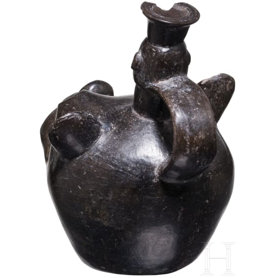 A Peruvian animal-head shaped blackware vessel, probably Chimu culture, 11th - 15th century