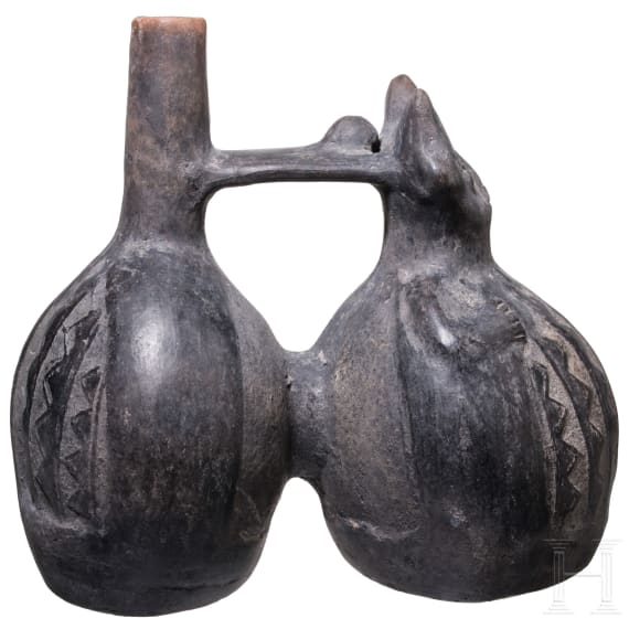A Peruvian figural clay double-vessel, probably Chimu culture, 11th - 15th century