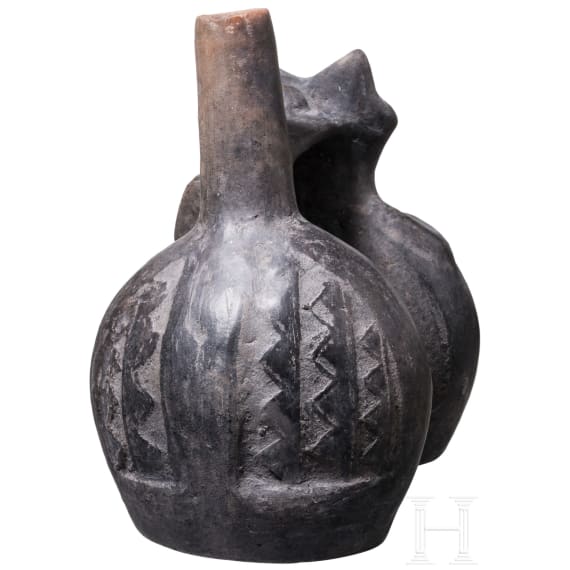 A Peruvian figural clay double-vessel, probably Chimu culture, 11th - 15th century