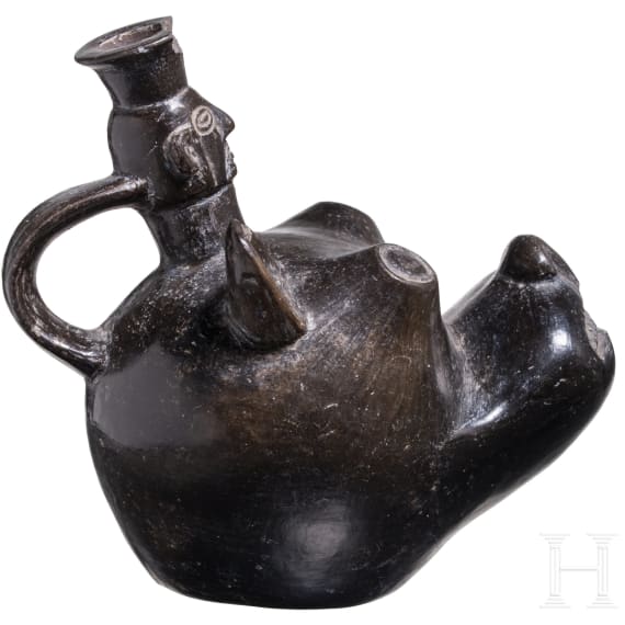 A Peruvian animal-head shaped blackware vessel, probably Chimu culture, 11th - 15th century