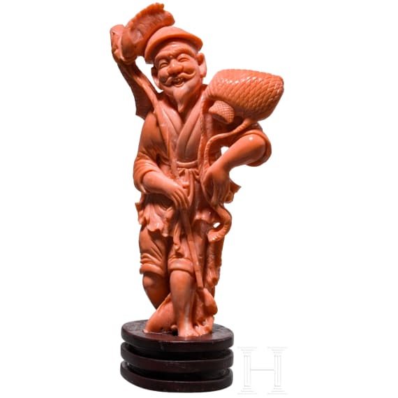 A figural coral carving showing a Chinese fisherman