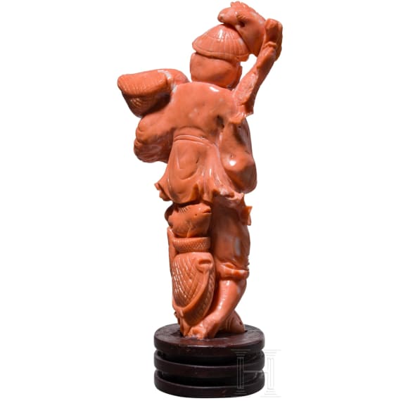 A figural coral carving showing a Chinese fisherman