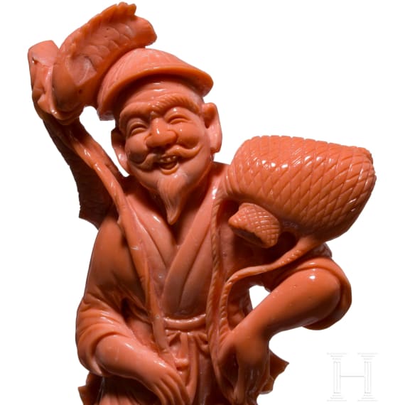 A figural coral carving showing a Chinese fisherman