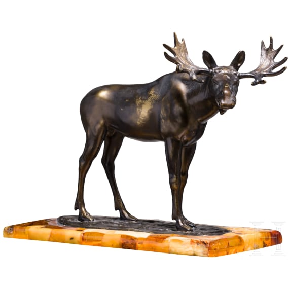 A bronze elk figure on an amber-mounted wooden stand, Hendrik Scholter, circa 1930