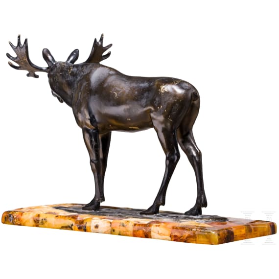 A bronze elk figure on an amber-mounted wooden stand, Hendrik Scholter, circa 1930