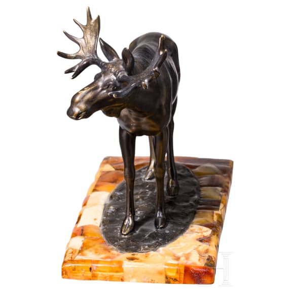 A bronze elk figure on an amber-mounted wooden stand, Hendrik Scholter, circa 1930