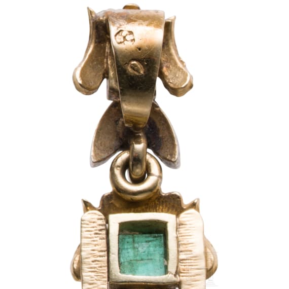 An 18ct gold cross pendant with diamonds (circa 0.56ct) and a gilt brooch with eagle