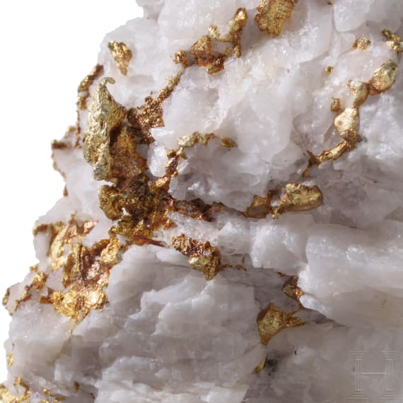 A white quartz with yellow gold veining