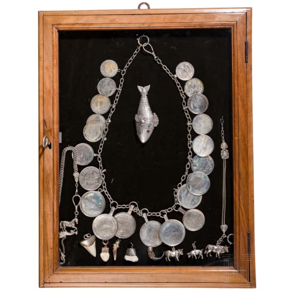 A group of German and Polish silver trinkets including a shooting champion's necklace, 19th century