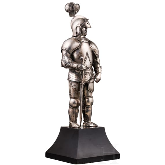 A silver figure of a knight (miniature armour)