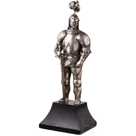 A silver figure of a knight (miniature armour)