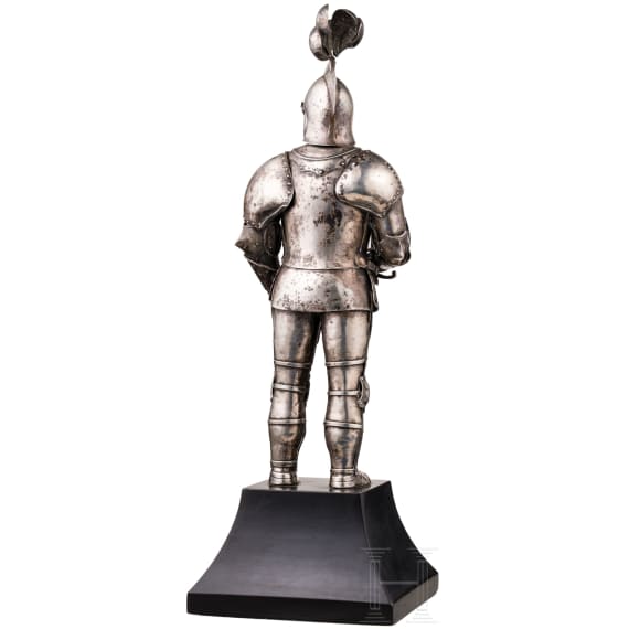 A silver figure of a knight (miniature armour)