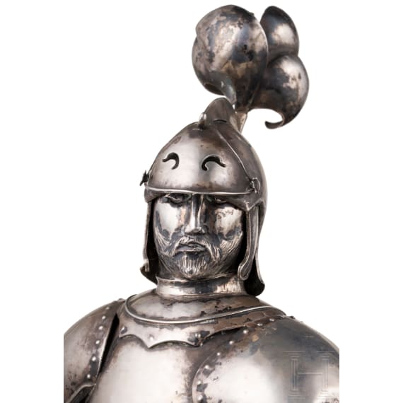 A silver figure of a knight (miniature armour)