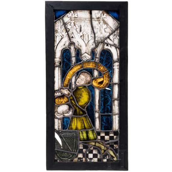 A German leaded stained glass window showing a praying donor, mid 15th century