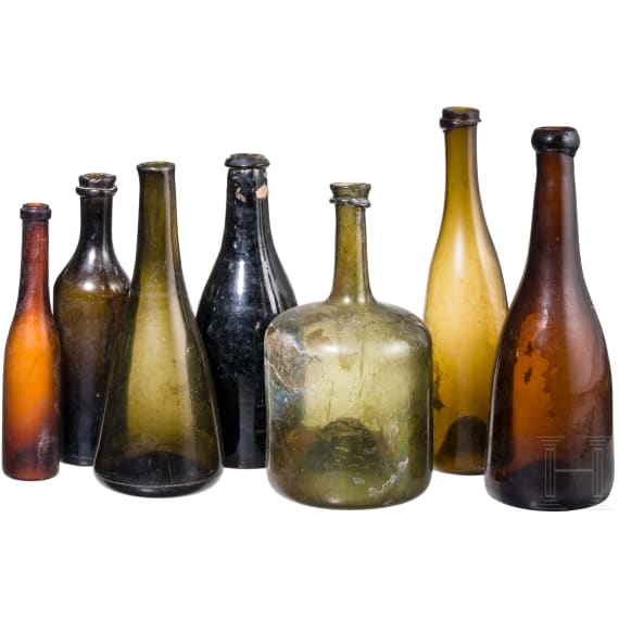 Seven German glass bottles, 18th (wine bottle)/19th century