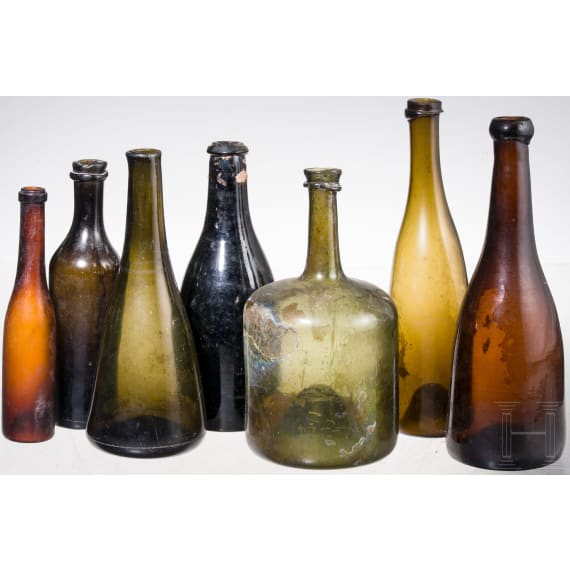Seven German glass bottles, 18th (wine bottle)/19th century