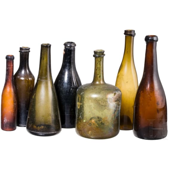 Seven German glass bottles, 18th (wine bottle)/19th century