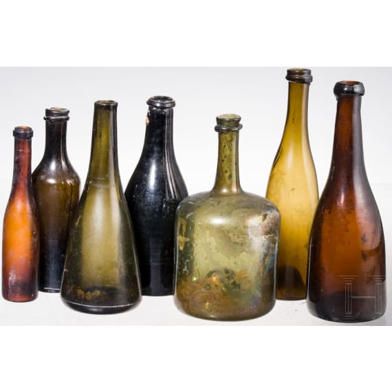 Seven German glass bottles, 18th (wine bottle)/19th century