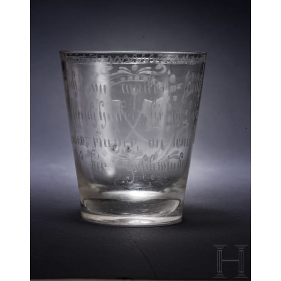 A glass beaker with emblem of the butcher guild, dated 1744