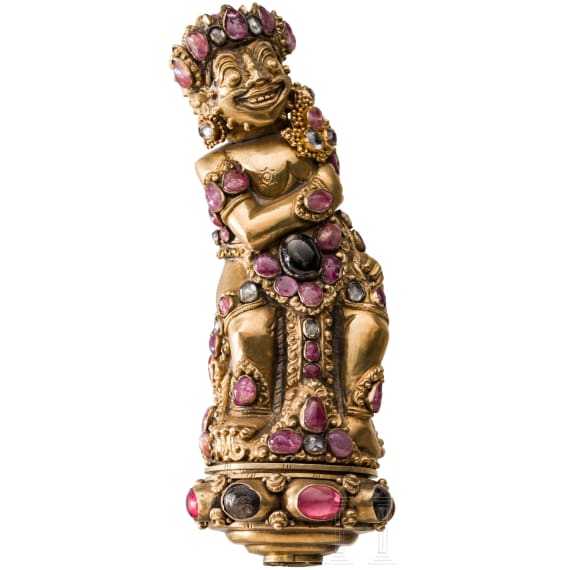 A Bali kris handle in the form of Bataru Bayu with a star sapphire, circa 1900