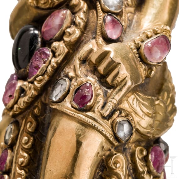 A Bali kris handle in the form of Bataru Bayu with a star sapphire, circa 1900